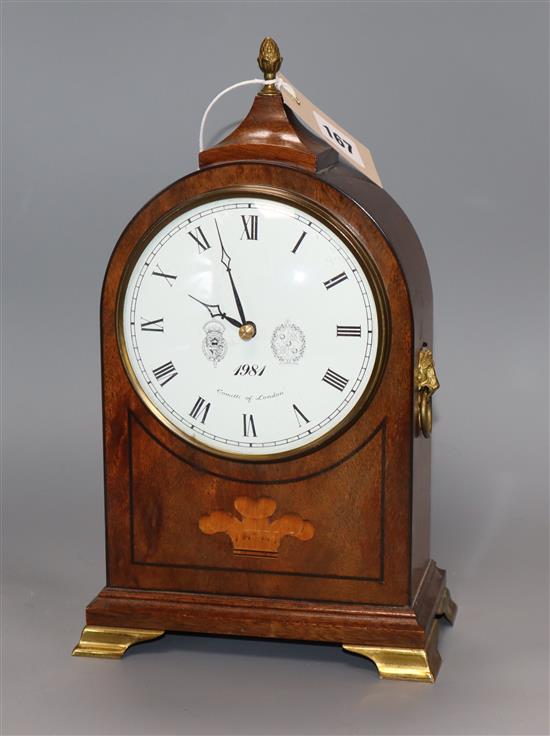 A dome-topped inlaid mahogany mantel clock